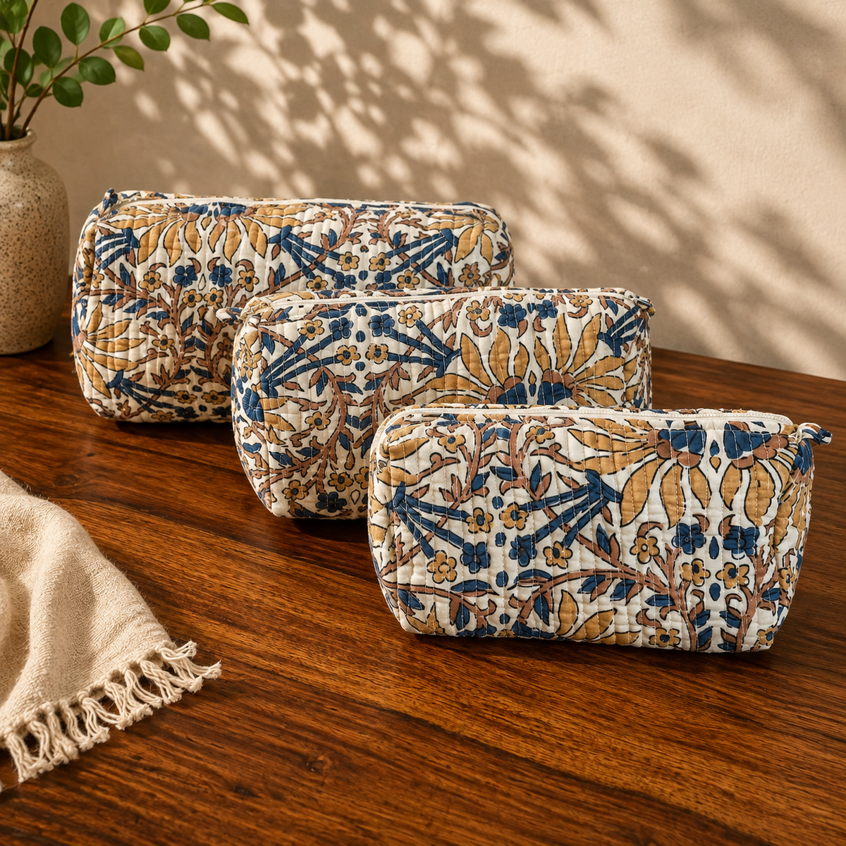Nilambari indigo and mustard quilted cotton pouch set, front view