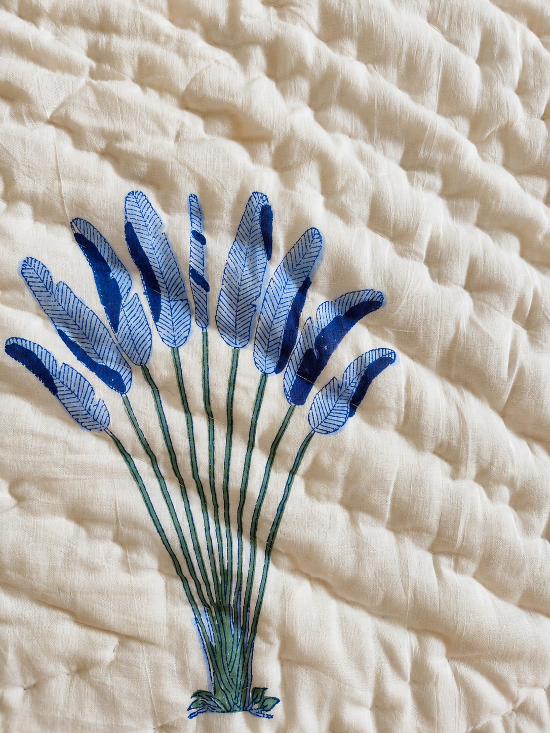 Close-up of Sagar quilt hand block printed lavender motif on quilted cotton