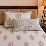 Kesariya orange hand block printed bedsheet on bed