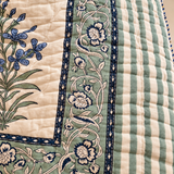 Nilgiri quilt border detail with green-blue floral vine and striped edge
