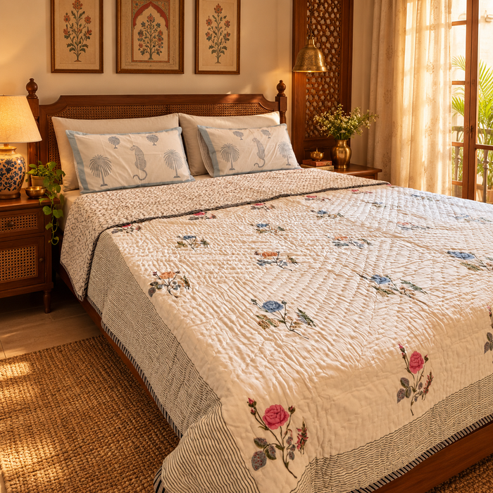 Basant multicolour rose hand block printed cotton quilt styled on bed